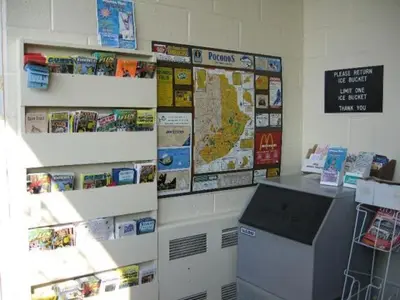 a room with a wall with a map and a counter at Paramount Motel Pocono in East Stroudsburg