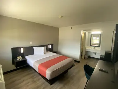 a hotel room with a bed and a television at Motel 6-Windsor Locks, CT - Hartford in Windsor Locks