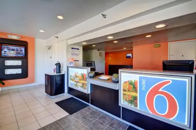 a fast food restaurant with a table with a number six at Motel 6-Windsor Locks, CT - Hartford in Windsor Locks