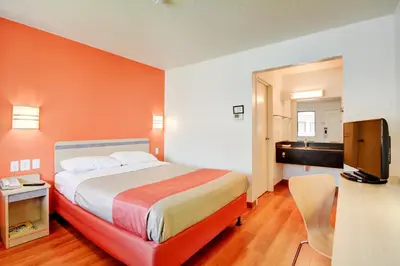 a hotel room with a bed and a television at Motel 6-Southington, CT - Hartford in Southington