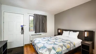 a hotel room with a bed and a window at Motel 6-Wethersfield, CT - Hartford in Wethersfield