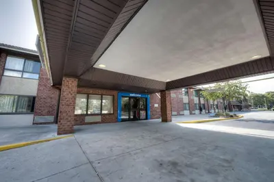 an empty parking lot in front of a building at Motel 6-Branford, CT - New Haven in Branford