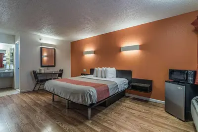 a hotel room with a bed and a desk at MOTEL 6 - Albany, NY - Airport in Albany