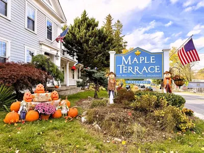 a sign for a magic terrace in front of a house at Maple Terrace Motel in Williamstown