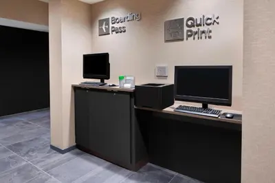 an office with two computer monitors on a desk at Courtyard by Marriott Albany Troy/Waterfront in Troy