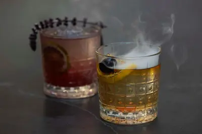 two glasses of drinks with smoke coming out of them at Hyatt Regency Greenwich in Greenwich