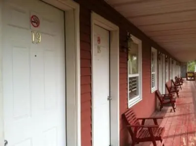 a row of benches on the porch of a house at Waterford Inn in Waterford