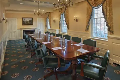 a conference room with a long table and chairs at Inn on Boltwood in Amherst