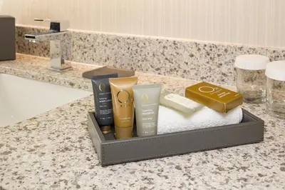 a tray with products on a counter in a bathroom at Inn at Middletown in Middletown