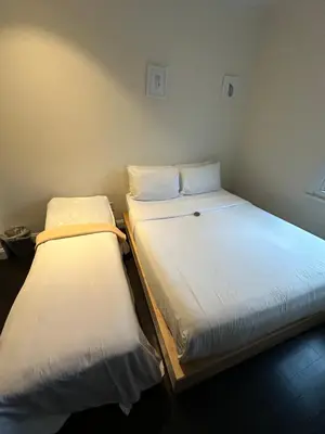 two beds sitting next to each other in a room at East Village Hotel in New York