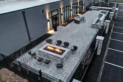 an overhead view of a patio with a fire pit at Courtyard by Marriott Southington in Southington