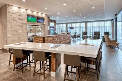 a large dining room with a large table and chairs at Courtyard by Marriott Southington in Southington