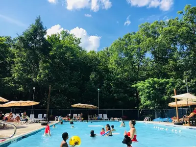 a group of people in a swimming pool at Big House On The Hill in East Stroudsburg