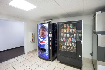 two vending machines in a room with drinks at Motel 6-Binghamton, NY in Binghamton