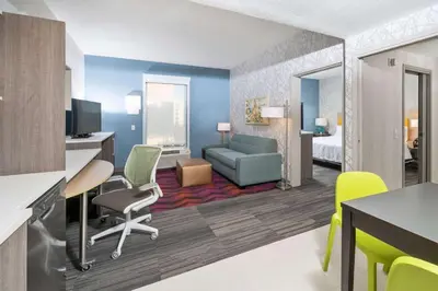 a rendering of a hotel suite with a living room at Home2 Suites By Hilton Newark Airport in Newark