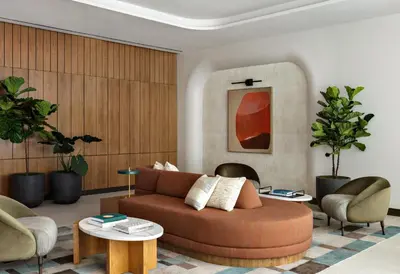 a living room with a couch and two chairs at Kimpton Theta New York - Times Square by IHG in New York