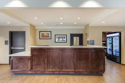 a large lobby with a bar in a building at Comfort Inn & Suites Schenectady - Scotia in Schenectady