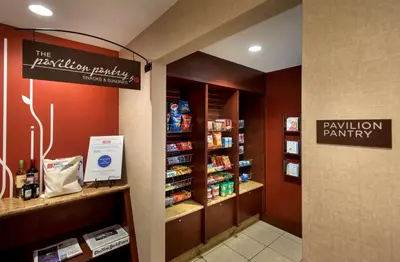 a pharmacy aisle with a pharmacyacistacistacistacistacist at Hilton Garden Inn Albany Medical Center in Albany