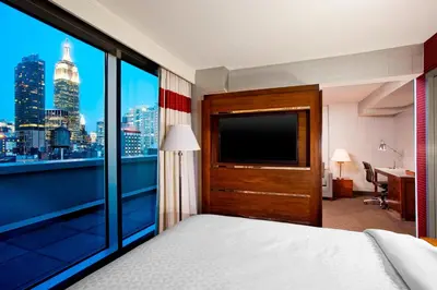 a hotel room with a view of the city at The Chelsean New York in New York