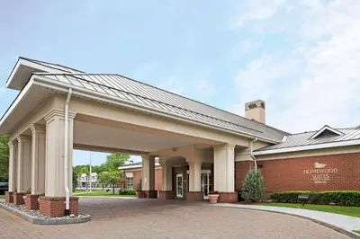 a brick school building with a large garage at Homewood Suites by Hilton Albany in Albany