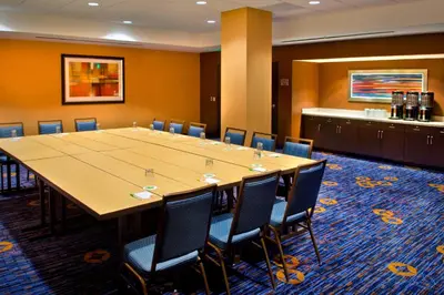 a large conference room with a long table and chairs at Courtyard by Marriott Newark Downtown in Newark