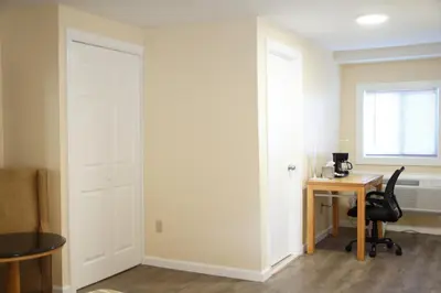 an office with a desk and a chair and a door at Rodeway Inn in Adams