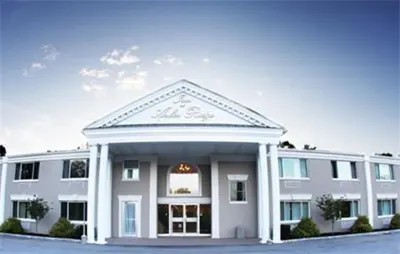 a large white building with a lot of windows at Inn at Arbor Ridge Hotel and Conference Center in Hopewell Junction