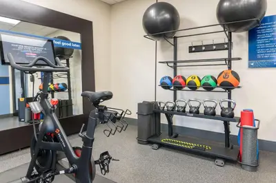 a gym with an exercise bike and balls at Hampton Inn & Suites Hartford-Manchester in Manchester