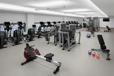 a gym with a lot of treadmills and machines at The Westin New York Grand Central in New York