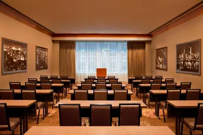 a conference room with tables and chairs and a large window at The Westin New York Grand Central in New York