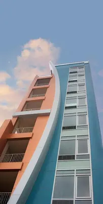 a tall building with the sky in the background at Nesva Hotel - New York City Vista in Queens