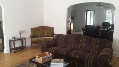 a living room with a couch and a table at Maurrocks - A Pocono Mountains B&B in Mount Pocono