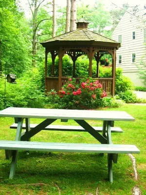 a picnic table in front of a gazebo at Stay Berkshires in Williamstown
