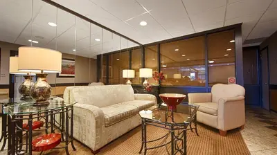 a living room with a couch and a table and chairs at West Gate Inn Nyack in Nyack