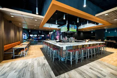 a bar with stools in a restaurant at The Kartrite Resort and Indoor Waterpark in Monticello