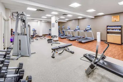 a gym with cardio equipment and treadmills at Embassy Suites Parsippany in Parsippany