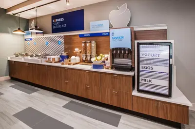 an apple store with a counter with an appleasteryasteryasteryasteryasteryasteryastery at Holiday Inn Express - Times Square South by IHG in New York