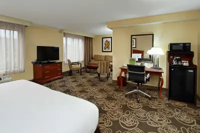 a hotel room with a bed and a desk at DoubleTree by Hilton Mahwah in Mahwah