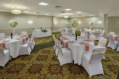 a banquet room with white tables and white chairs at DoubleTree by Hilton Mahwah in Mahwah