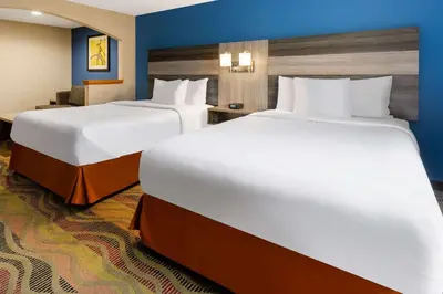 two large beds in a hotel room with at Baymont by Wyndham Budd Lake in Budd Lake