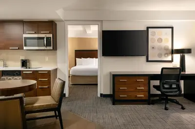 a hotel room with a kitchen and a bedroom at Residence Inn by Marriott New York Manhattan/ Midtown Eastside in New York