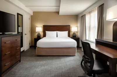 a bedroom with a bed and a desk and a television at Residence Inn by Marriott New York Manhattan/ Midtown Eastside in New York
