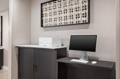 a desk with a monitor and a computer on it at Residence Inn by Marriott New York Manhattan/ Midtown Eastside in New York