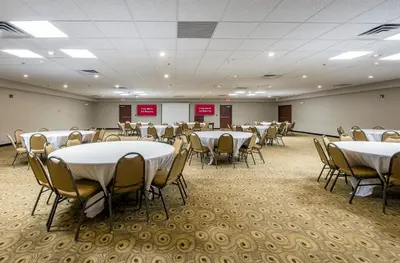 a conference room with tables and chairs in it at Red Roof Inn Hartford- New Britain in New Britain