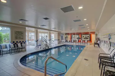 a large swimming pool in a hotel room at Hilton Garden Inn Norwalk in Norwalk