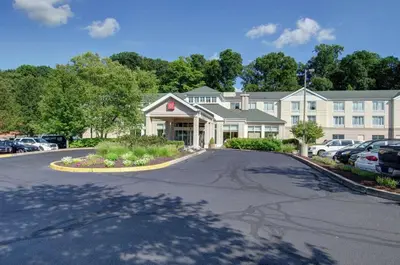 a street in front of a large building at Hilton Garden Inn Norwalk in Norwalk
