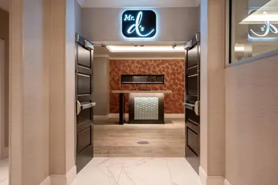 a dressing room with a fireplace and a sign on the wall at Crowne Plaza Albany - The Desmond Hotel in Albany