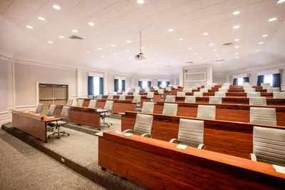 a large lecture hall with desks and chairs in it at Crowne Plaza Albany - The Desmond Hotel in Albany