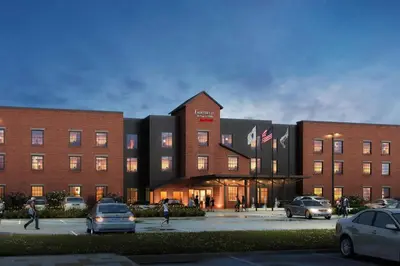 a building with cars parked in front of it at Fairfield Inn & Suites by Marriott Williamstown in Williamstown