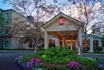 a building with a sign on top of it at Hilton Garden Inn Saratoga Springs in Saratoga Springs